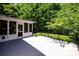 Back deck features black railings, views of screened in porch and a lush yard at 3546 Weddington Oaks Dr, Weddington, NC 28104