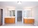 Bright, expansive bathroom with dual vanities, tile floor, and separate doors at 3546 Weddington Oaks Dr, Weddington, NC 28104