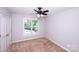 Cozy bedroom with neutral carpet, a window with blinds, and a ceiling fan at 3546 Weddington Oaks Dr, Weddington, NC 28104