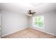 Neutral bedroom featuring a ceiling fan, and a window that allows plenty of natural light at 3546 Weddington Oaks Dr, Weddington, NC 28104