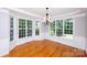 Elegant dining room with hardwood floors, bay window, and a chandelier, perfect for hosting dinner parties at 3546 Weddington Oaks Dr, Weddington, NC 28104