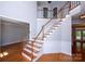 Welcoming two-story foyer with hardwood floors, elegant staircase, and natural light, creating a grand entrance at 3546 Weddington Oaks Dr, Weddington, NC 28104