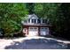 Large three car garage with spacious driveway, beautiful brick, and green landscaping at 3546 Weddington Oaks Dr, Weddington, NC 28104