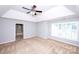 Spacious main bedroom with a tray ceiling and lots of windows offers natural light at 3546 Weddington Oaks Dr, Weddington, NC 28104