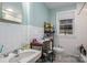 Bathroom has a neutral color palette, tiled walls, and window light at 400 Houser St, Cherryville, NC 28021