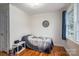 Bright bedroom with hardwood floors, a ceiling fan, and a large window at 400 Houser St, Cherryville, NC 28021