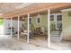 Spacious carport area with seating, ceiling fans and steps leading to the house at 400 Houser St, Cherryville, NC 28021