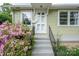 Inviting front entrance with pink azaleas and well-maintained steps at 400 Houser St, Cherryville, NC 28021