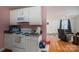 Cozy kitchen opens to living area with hardwood floors and white appliances at 400 Houser St, Cherryville, NC 28021