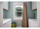 Well-lit laundry room with storage cabinets and window view to the exterior at 400 Houser St, Cherryville, NC 28021