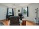 Comfortable living room with a large window, TV, and hardwood floors at 400 Houser St, Cherryville, NC 28021