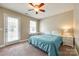 Cozy bedroom featuring a ceiling fan, a large window, and private outdoor access at 4704 Amberside Dr, Rock Hill, SC 29732