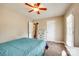 Bright bedroom with ceiling fan, large window, and private outdoor access to a balcony at 4704 Amberside Dr, Rock Hill, SC 29732