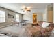 Bright game room featuring ping pong table, comfortable chair, and backyard view at 4704 Amberside Dr, Rock Hill, SC 29732