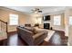 Comfortable living room with a fireplace, large sectional sofa, ceiling fan, and ample natural light at 4704 Amberside Dr, Rock Hill, SC 29732