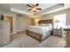 Spacious main bedroom with a large bed, tray ceiling, and stylish wooden furniture at 4704 Amberside Dr, Rock Hill, SC 29732
