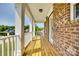 Covered porch with wood floors and white columns at 4704 Amberside Dr, Rock Hill, SC 29732