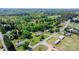 Aerial view of the property featuring a well-maintained lawn, home, and detached garage at 4815 Rifle Range Rd, Conover, NC 28613