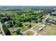 This property features an aerial view showcasing its location within a green, wooded neighborhood at 4815 Rifle Range Rd, Conover, NC 28613
