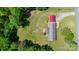 Aerial view of property showing home, large lot, detached garage, and mature trees at 4815 Rifle Range Rd, Conover, NC 28613