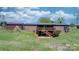 Exterior showcasing a wooden deck, a brick facade and a large lawn, offering a private outdoor space at 4815 Rifle Range Rd, Conover, NC 28613
