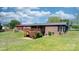 Back of the home features a spacious wooden deck and a screened-in porch at 4815 Rifle Range Rd, Conover, NC 28613