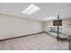 Finished basement area with tile flooring and tanning bed, offering additional living space at 4815 Rifle Range Rd, Conover, NC 28613
