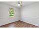 Neutral bedroom with a ceiling fan and a window offering natural light at 4815 Rifle Range Rd, Conover, NC 28613