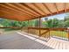 This home has a spacious wooden deck with a covered area, perfect for outdoor enjoyment and relaxation at 4815 Rifle Range Rd, Conover, NC 28613