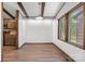 Inviting dining room with exposed beams, hardwood floors, and natural light perfect for Gathering gatherings and entertaining at 4815 Rifle Range Rd, Conover, NC 28613