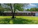 Attractive brick ranch home with metal roof, detached garage and lush green lawn at 4815 Rifle Range Rd, Conover, NC 28613