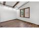 Bright room with exposed beams, hardwood floors, and natural light perfect for Gathering gatherings and entertaining at 4815 Rifle Range Rd, Conover, NC 28613