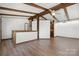 Bright, spacious living room with wood floors, exposed beams, and white walls creating a cozy atmosphere at 4815 Rifle Range Rd, Conover, NC 28613