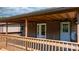 Charming porch with wooden deck, brick exterior and covered ceiling providing a welcoming entrance to the home at 4815 Rifle Range Rd, Conover, NC 28613