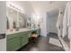 Bright bathroom with dual sinks, a large mirror, and a walk-in shower at 5707 Parkstone Dr, Matthews, NC 28104