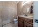 Cozy half bathroom with updated vanity, modern lighting, and a tile accent wall at 5707 Parkstone Dr, Matthews, NC 28104