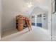 Well-lit bedroom with a built-in bunk bed and ample space for activities at 5707 Parkstone Dr, Matthews, NC 28104