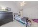 Cozy bedroom with vaulted ceiling features a ceiling fan, large closet and light violet walls at 5707 Parkstone Dr, Matthews, NC 28104