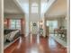 Inviting entryway with soaring ceilings, hardwood floors, and views into the living and dining rooms at 5707 Parkstone Dr, Matthews, NC 28104