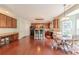 Well-appointed kitchen featuring wood cabinets, stainless steel appliances, and a breakfast bar area at 5707 Parkstone Dr, Matthews, NC 28104