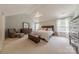 Spacious main bedroom with vaulted ceiling, walk-in closet, and large windows at 5707 Parkstone Dr, Matthews, NC 28104