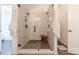Modern walk-in shower featuring a rainfall showerhead, and tile surround at 5707 Parkstone Dr, Matthews, NC 28104
