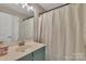 Well-lit bathroom with a shower/tub combination, modern vanity, and ample storage space at 5775 Monticello Nw Dr, Concord, NC 28027