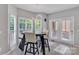 Cozy breakfast nook surrounded by windows, offering a bright space for morning meals at 5775 Monticello Nw Dr, Concord, NC 28027
