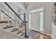 Welcoming foyer with a staircase, hardwood floors, and plenty of natural light at 5775 Monticello Nw Dr, Concord, NC 28027