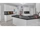 Bright kitchen featuring white cabinets, stainless steel appliances, and granite countertops offers ample space at 5775 Monticello Nw Dr, Concord, NC 28027