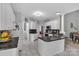 Spacious kitchen with white cabinets, dark countertops, and modern appliances creates a functional space at 5775 Monticello Nw Dr, Concord, NC 28027