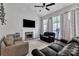 Inviting living room with a fireplace, large windows, and comfortable seating provides a cozy atmosphere at 5775 Monticello Nw Dr, Concord, NC 28027