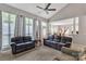 Spacious living room featuring large windows, neutral tones, and an open layout for easy flow at 5775 Monticello Nw Dr, Concord, NC 28027