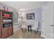 Well-lit office space with built-in shelves and seating near a window at 5775 Monticello Nw Dr, Concord, NC 28027